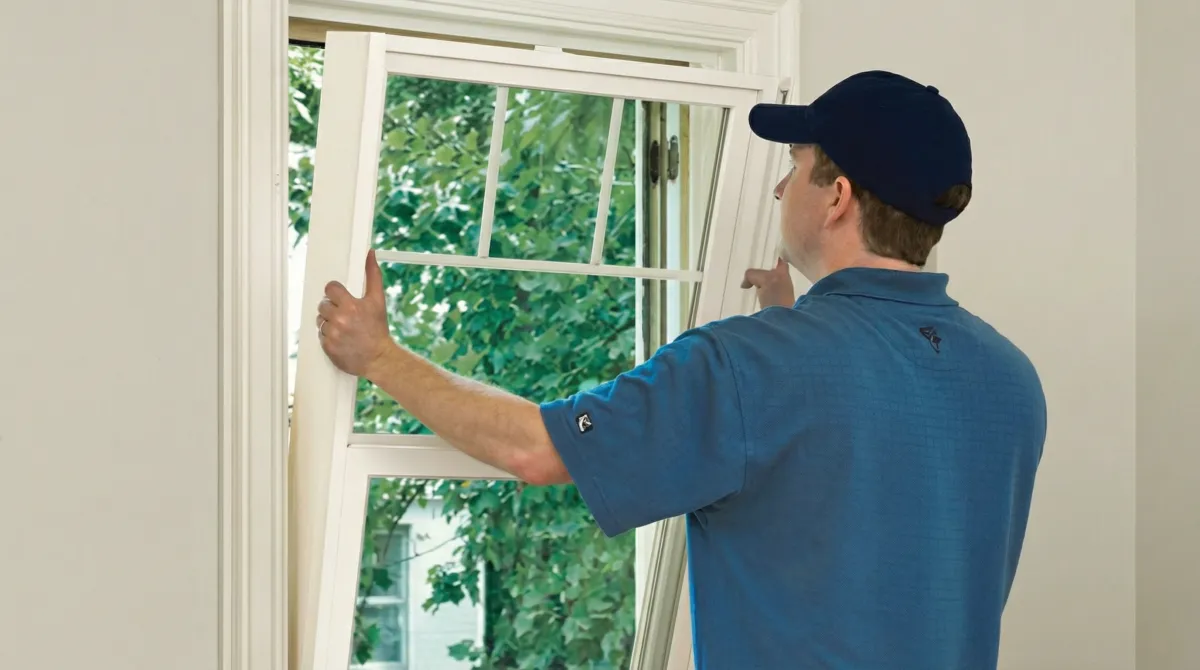 Professional contractors performing a residential window insulation and replacement service in Portland, OR